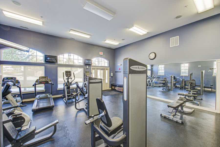 The best graduate housing will have amenities like this fitness center at City Flats at Renwick in Bloomington. Fitness center with aerobic and strength training equipment at apartment complex