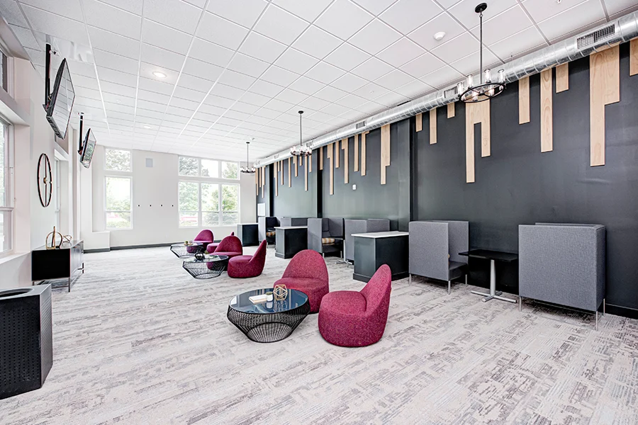 Long view of a trendy apartment clubhouse common room